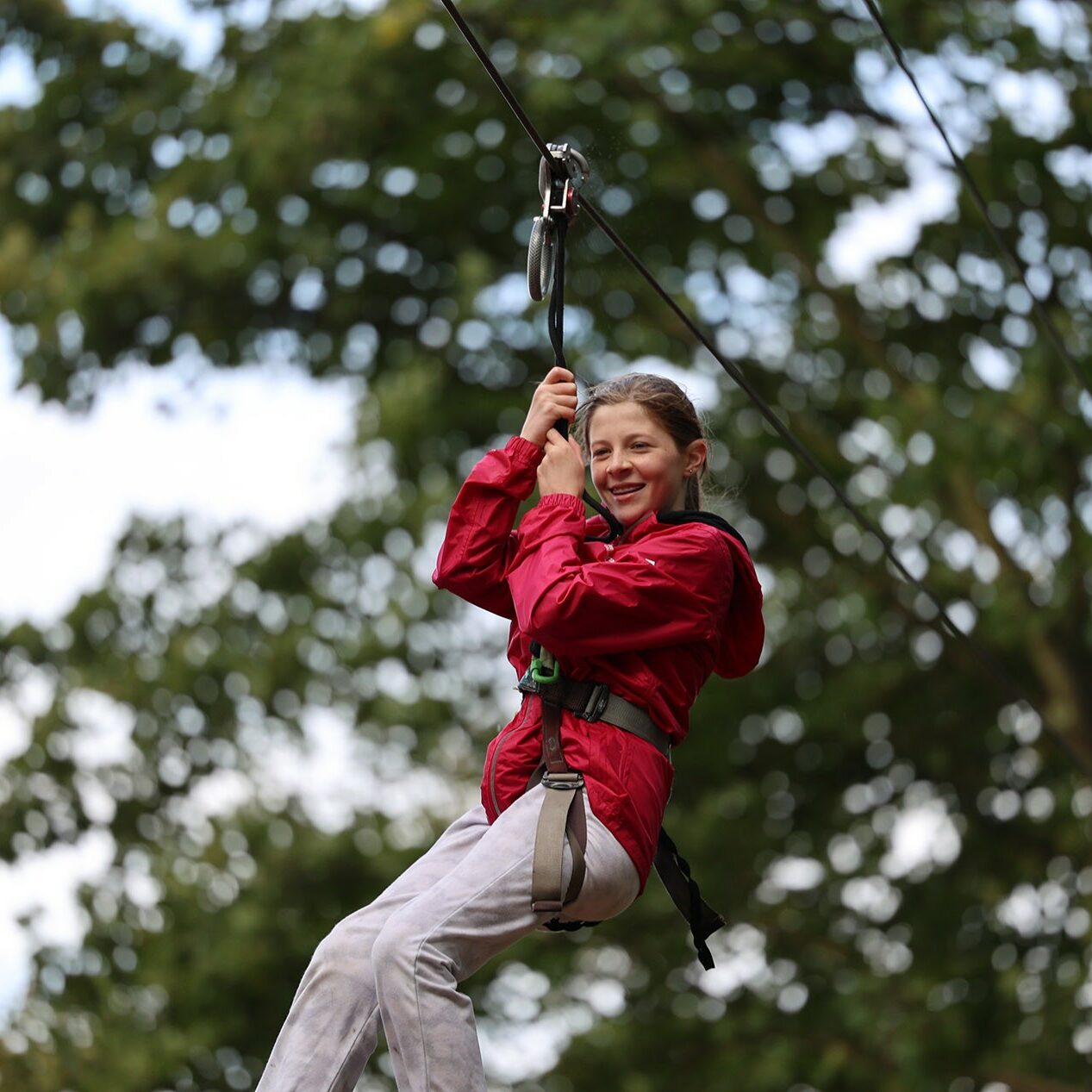 girl on the zipline at oakfire adventures